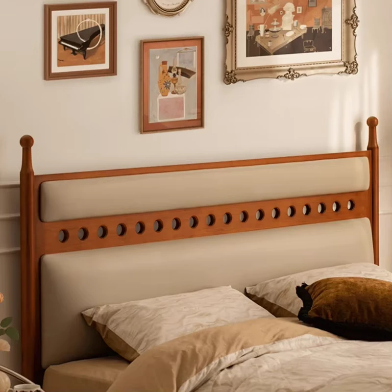 walnut-bed-frame-upholstered-headboard-carved-holes-detail Walnut bed frame upholstered headboard carved hole detail close up