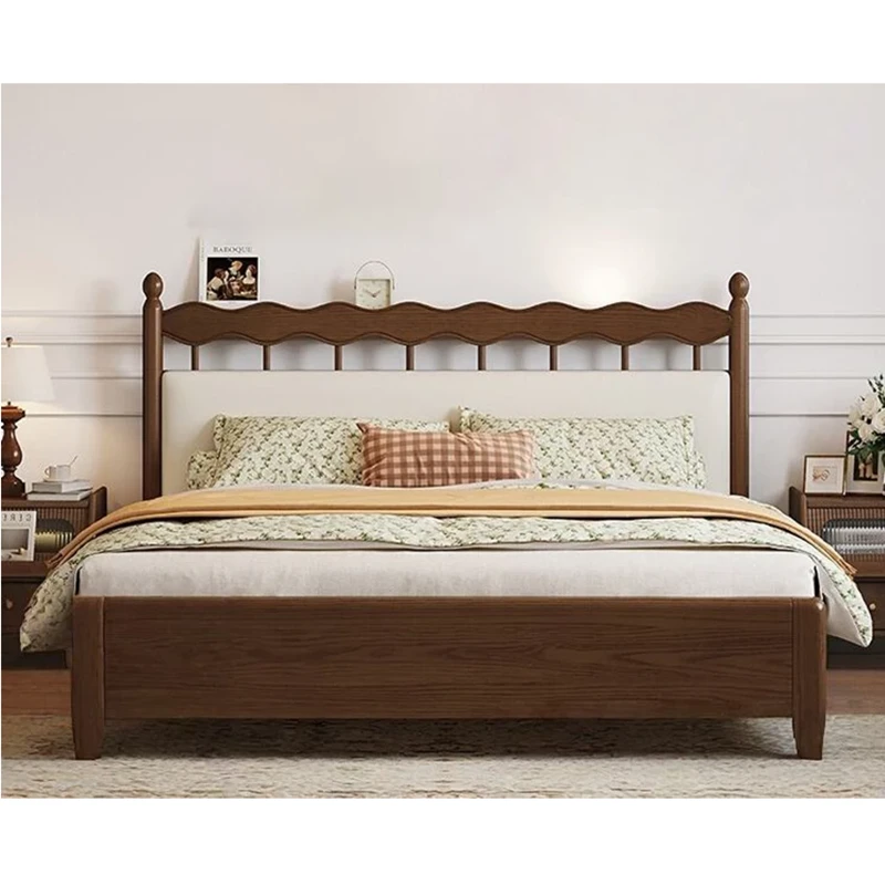 Walnut bed frame with upholstered wavy headboard shown in a front view