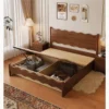 Walnut gas lift storage bed showing large underbed storage space