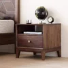 Walnut nightstand bedside table with globe and clock in bedroom scene