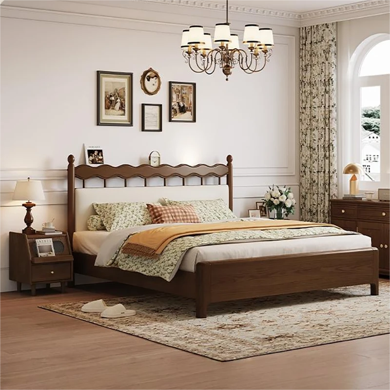 Walnut bed frame with spindle headboard and cream upholstered panels front view
