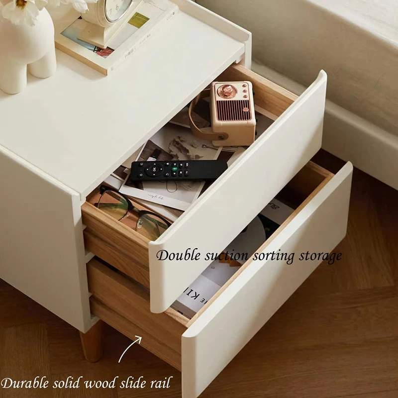 White nightstand with double drawers open on solid wood slide rails