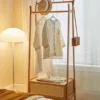 wooden-clothes-rack-bedroom-corner-view Wooden clothes rack bedroom corner view with hat and tote bag