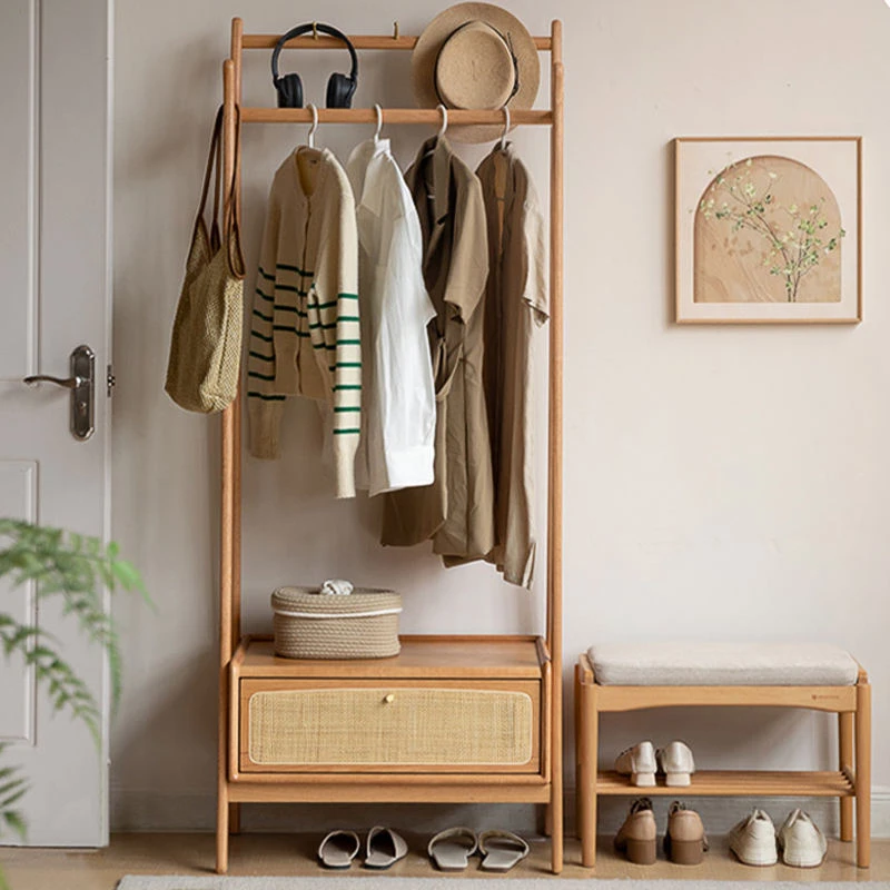 wooden-garment-rack-bedroom-hanging-scene Wooden garment rack with hanging clothes in a bright bedroom scene