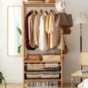 wooden-garment-rack-dimensions-lifestyle-scene Wooden garment rack with clothes mirror and baskets in lifestyle scene